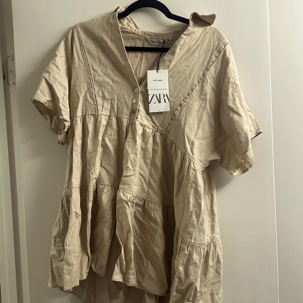 New mini dress that’s cream colored and looking for a good home
